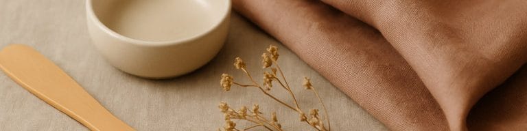 Bamboo spatula, warm fabric folds, dried wildflowers. Bikini line waxing. Skincare & Waxing Kirkham.