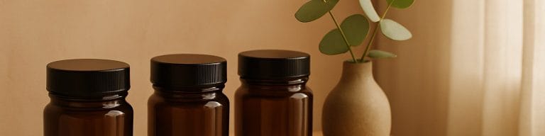 Amber skincare jars, eucalyptus, soft natural light. Facial treatment. Skincare & Waxing Kirkham.