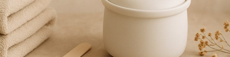 Beige towels, spatula, ceramic wax pot, dried stems. Bikini waxing. Skincare & Waxing Kirkham.