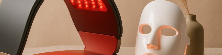 Pro LED panel beside home LED mask, beige still life. LED light therapy mask. Skincare & Waxing Kirkham.