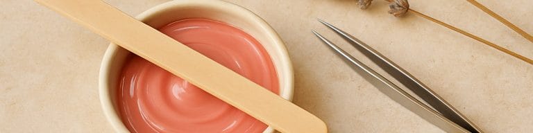 Brow waxing tools: ceramic dish, spatula, tweezers, dried lavender. Brow waxing. Skincare & Waxing Kirkham.
